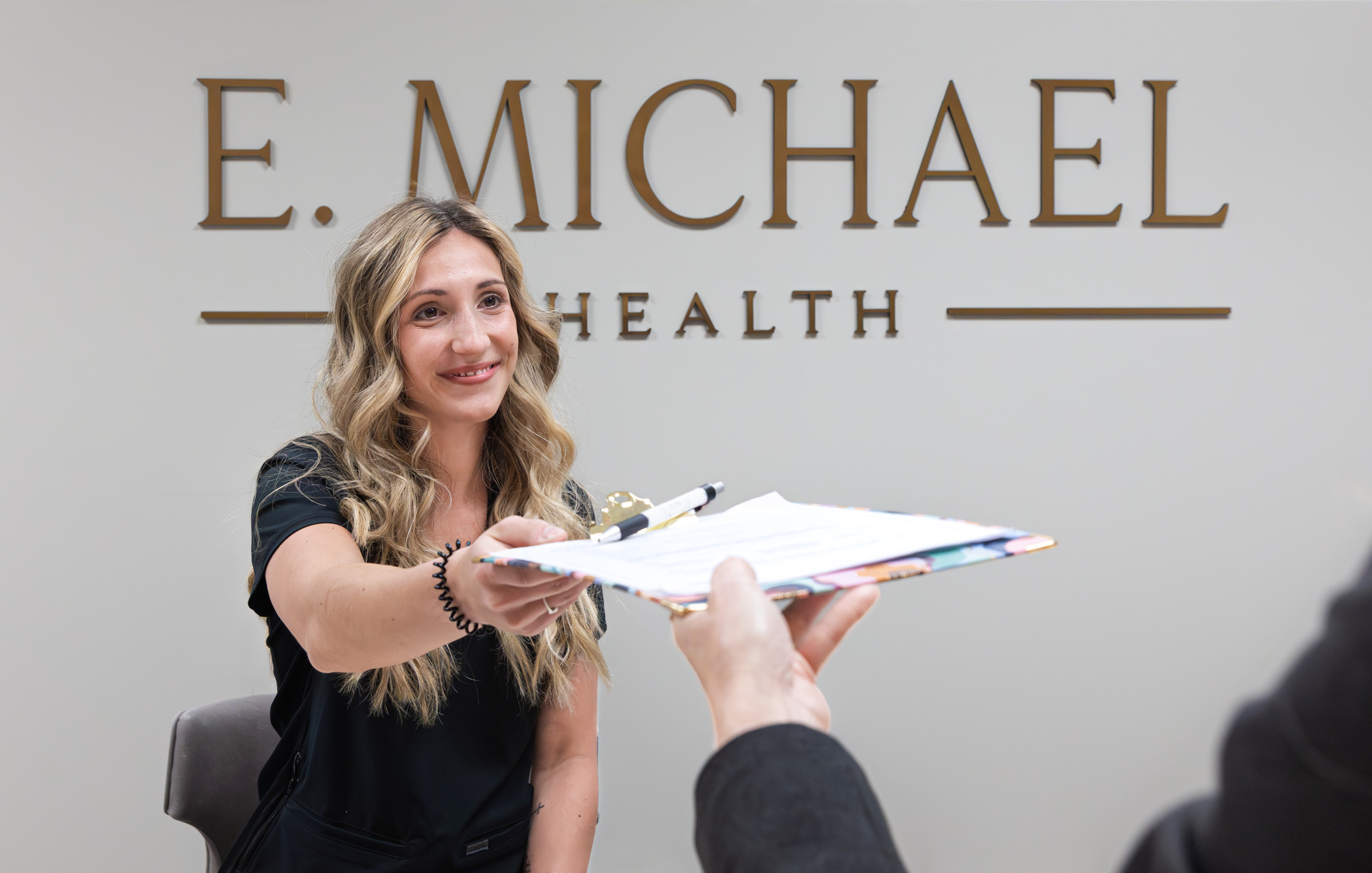 The welcome area beneath the E. Michael Health sign