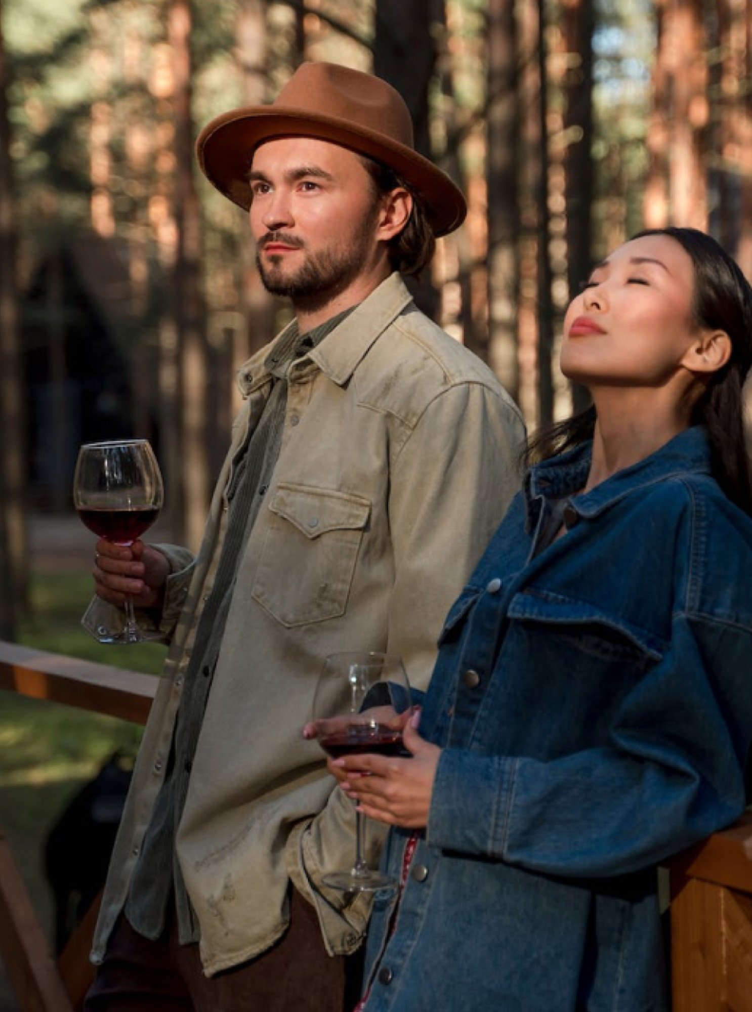 A couple sharing a glass of wine on an evening walk together