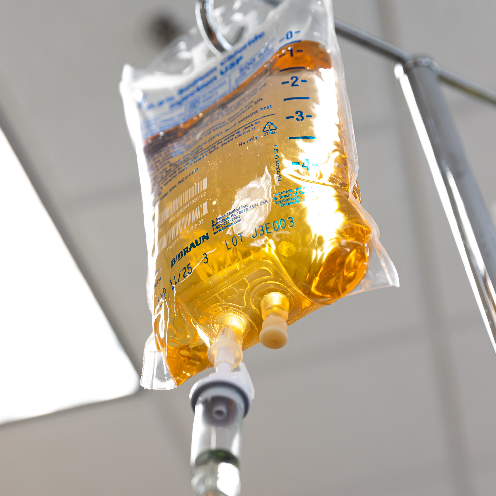 A nutrient IV bag hanging in the infusion room at E. Michael Health